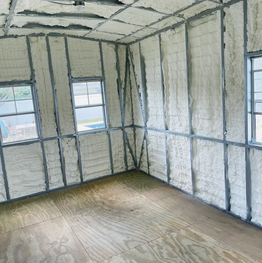 Closed-cell spray foam insulation applied to wall cavities in a residential project in Bastrop